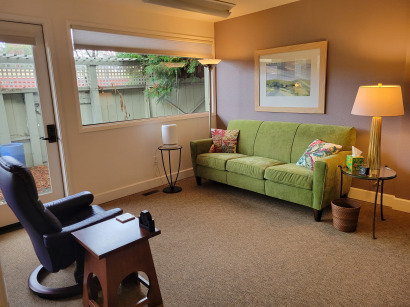 Comfortable therapy office with a couch and armchair