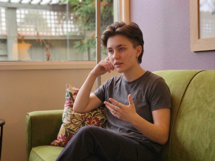 Person sitting on a couch during a therapy conversation